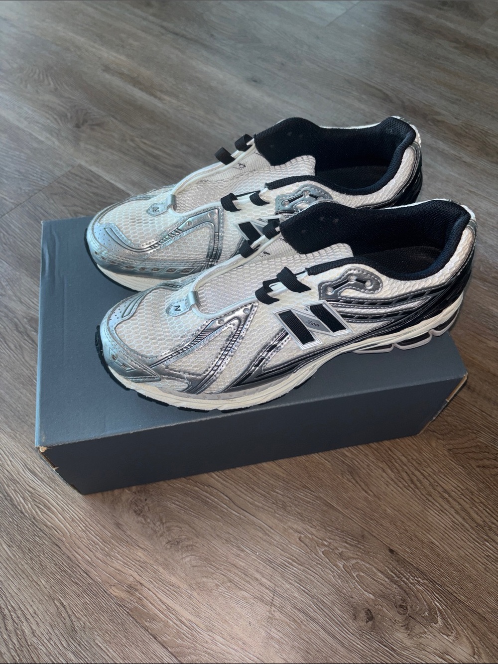 New Balance Silver and Black Athletic Sneakers